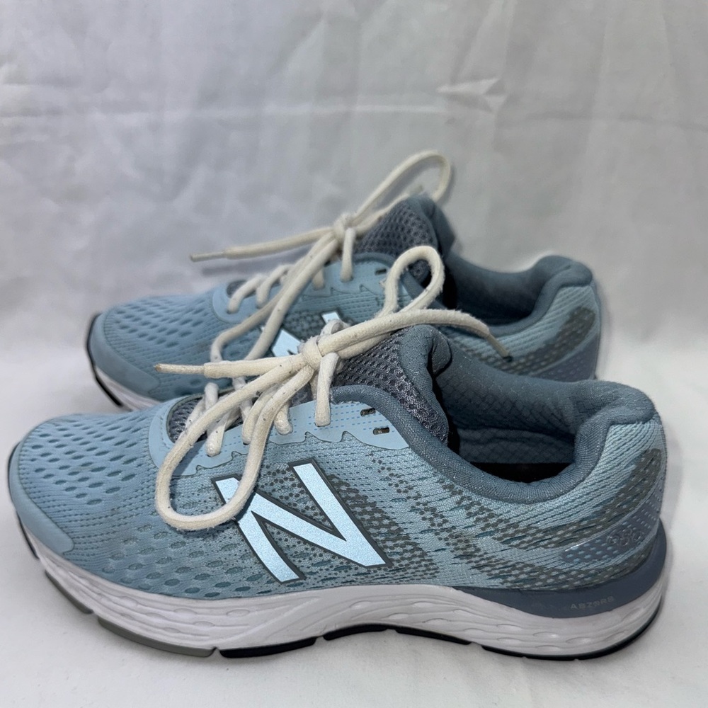 New Balance 680v6 running shoes in a light blue/grey colorway size 8
